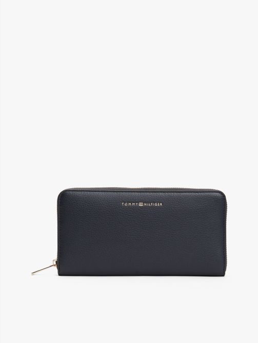 محفظة كبيرة بسحاب دائري مزينة بعلم الشعار