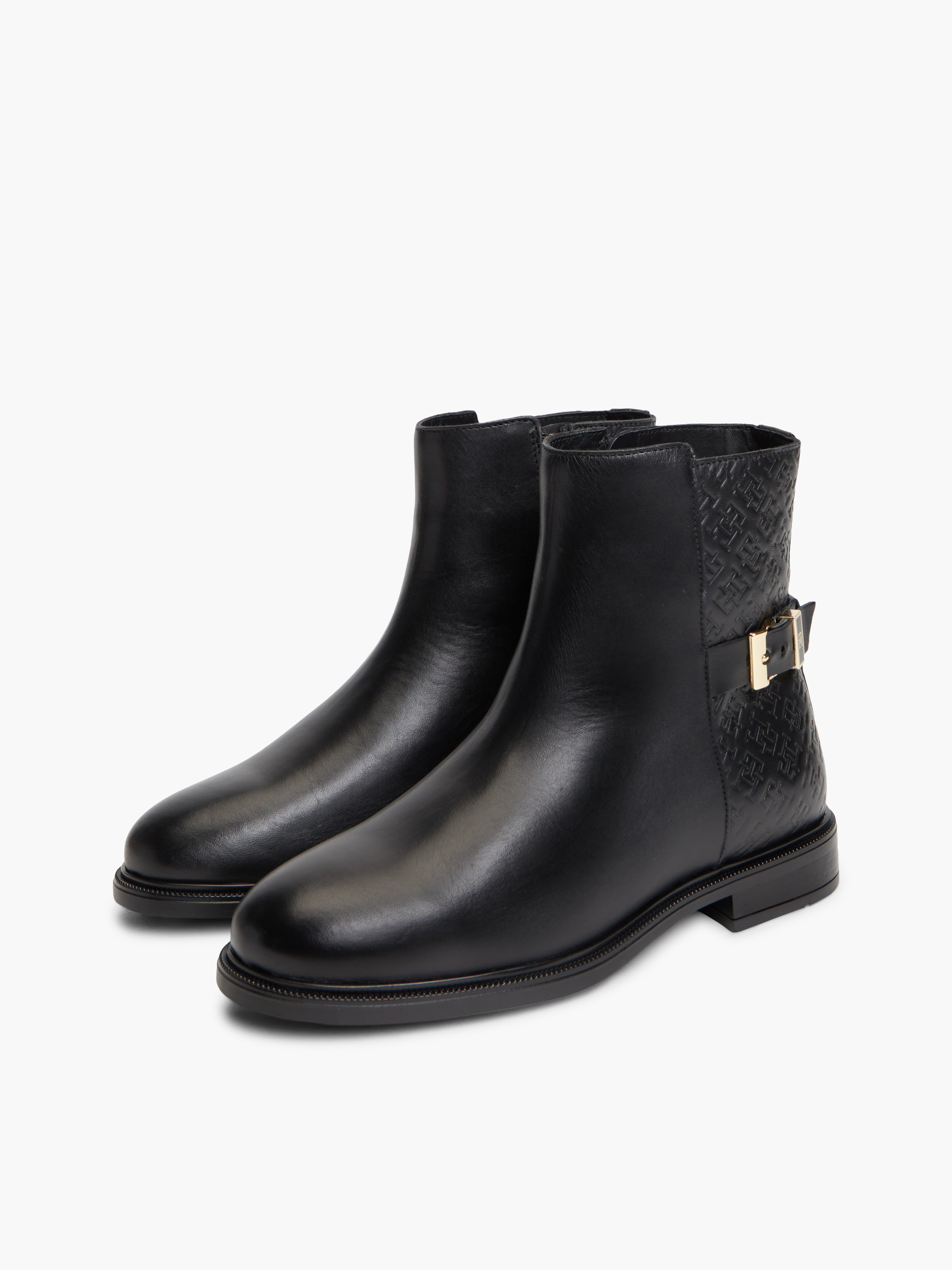 TH Monogram Embossed Leather Ankle Boots