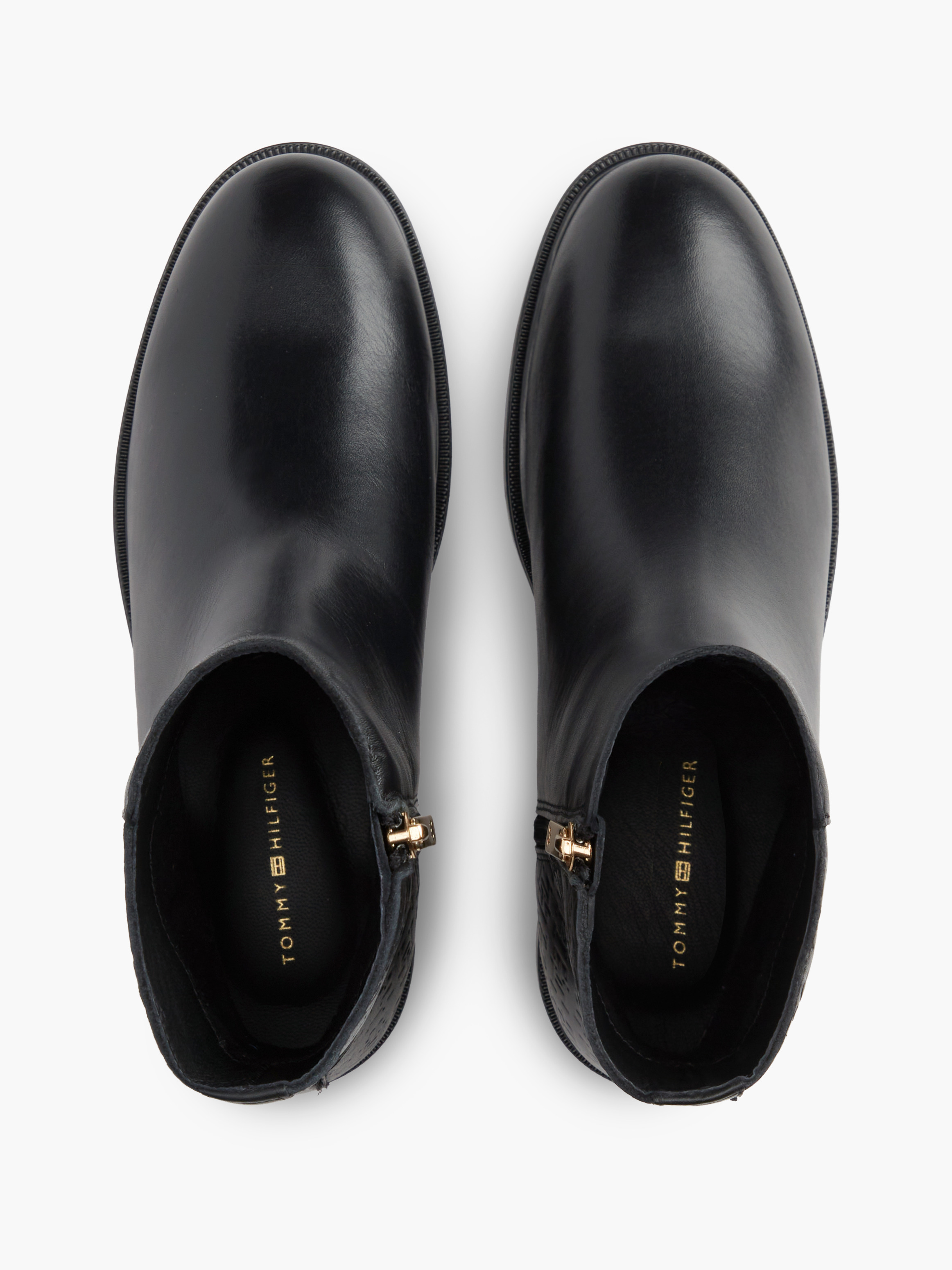 TH Monogram Embossed Leather Ankle Boots