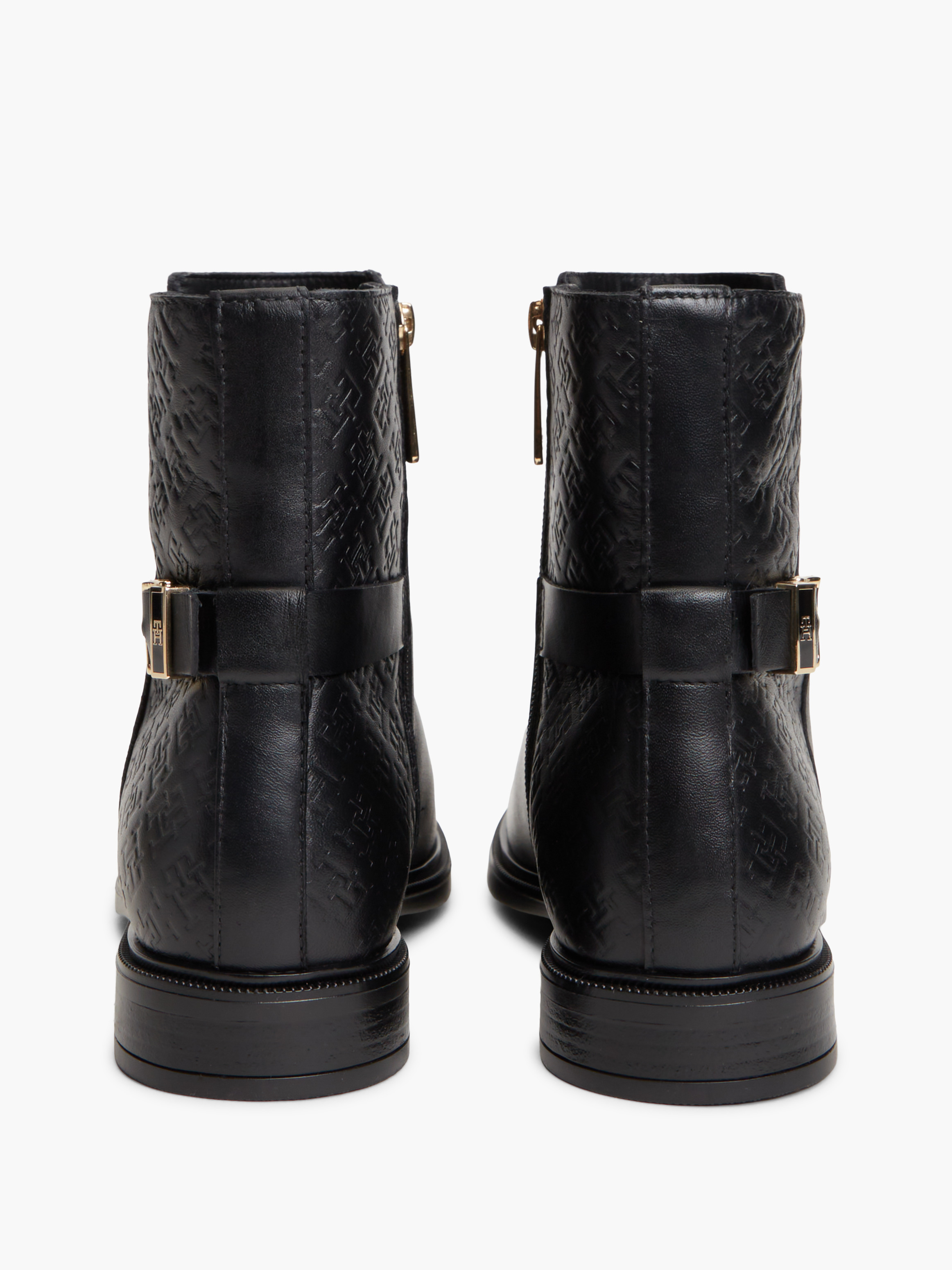 TH Monogram Embossed Leather Ankle Boots