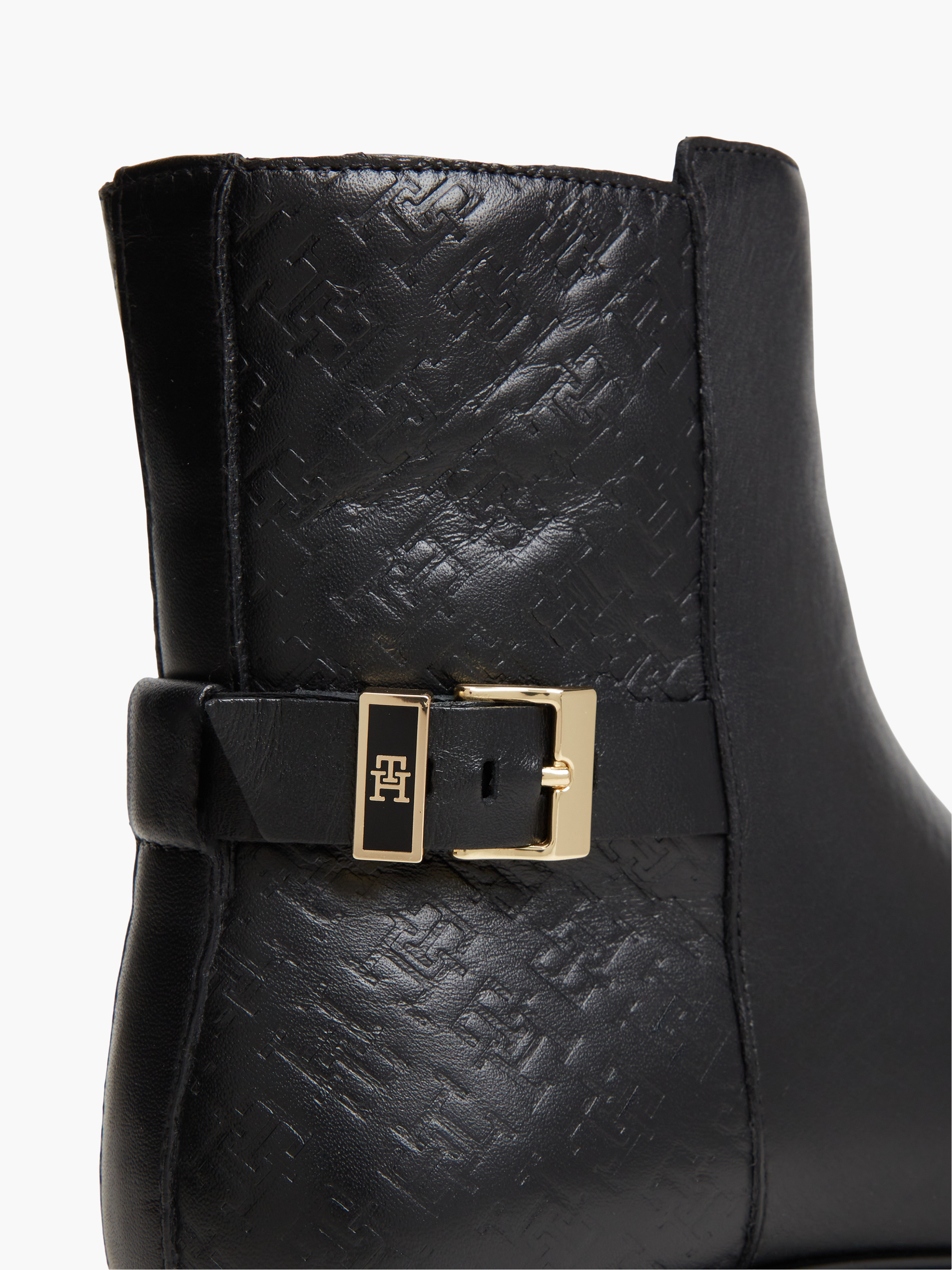 TH Monogram Embossed Leather Ankle Boots